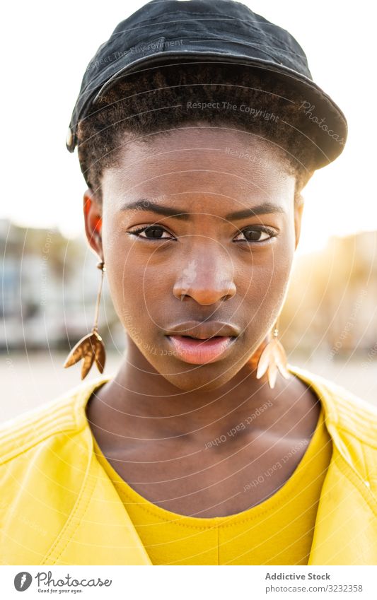 Portrait of a black woman stylish african american female jacket bright cute attractive positive healthy charming young pretty modern cheerful relax chill rest