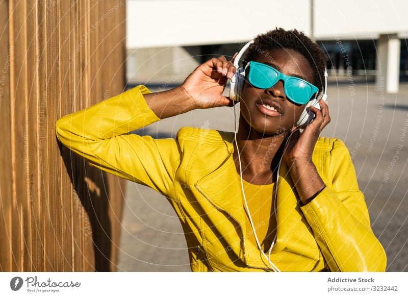 Portrait of a black woman stylish african american female jacket cute attractive positive healthy charming young pretty modern cheerful relax chill beauty