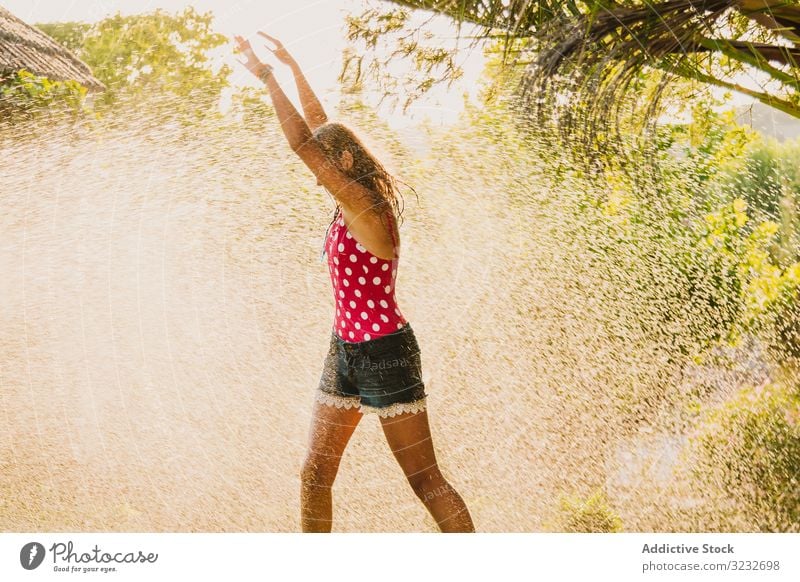 Cheerful girl jumping into pool - a Royalty Free Stock Photo from Photocase