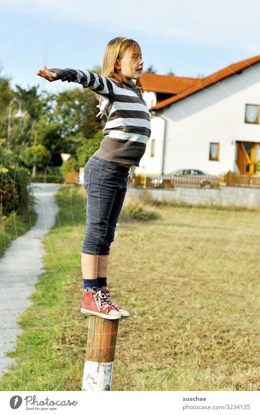 climber (done) Child Girl boyish Climbing Playing Reckless Pole Wooden stake Fence post Exterior shot Footpath House (Residential Structure) Village Building