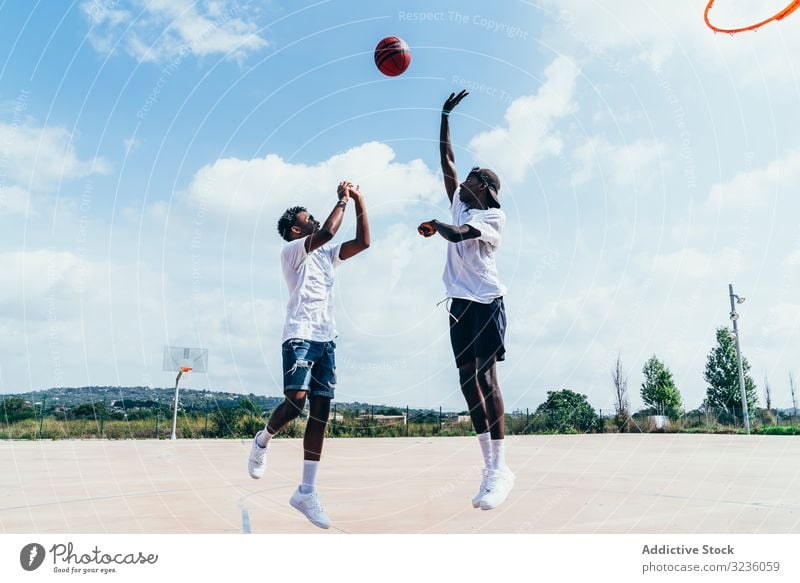 African American guys playing basketball in bright day sportsmen training player activity athlete skill action black african american court athletic