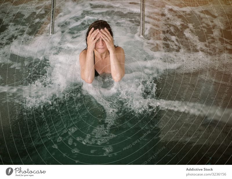 Young slim women in swimming pool - a Royalty Free Stock Photo