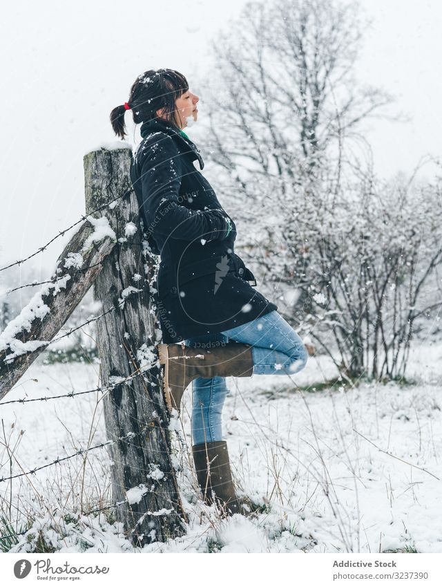 Young girl enjoying snowfall hi-res stock photography and images