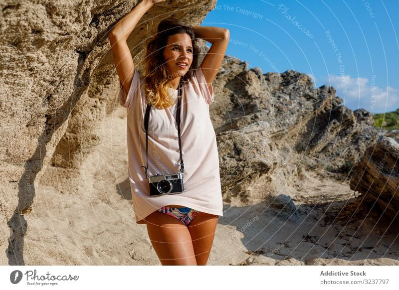 Woman standing on stony cliff landscape woman taking photo rock photographer tourist travel mountain nature hiking adventure camera stone photography valley