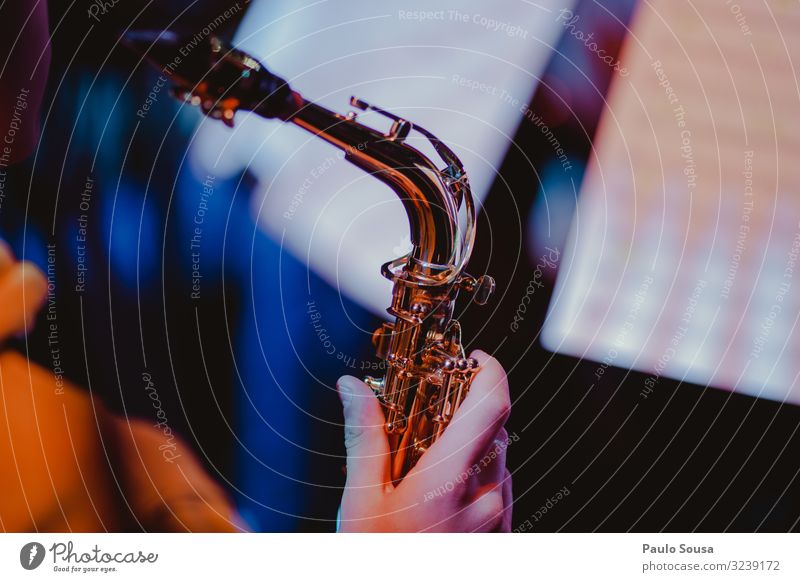 Close up hand holding a saxophone Saxophone Music Saxophon player Musician Human being Youth (Young adults) Brass Elegant Blues Sound Classical Professional