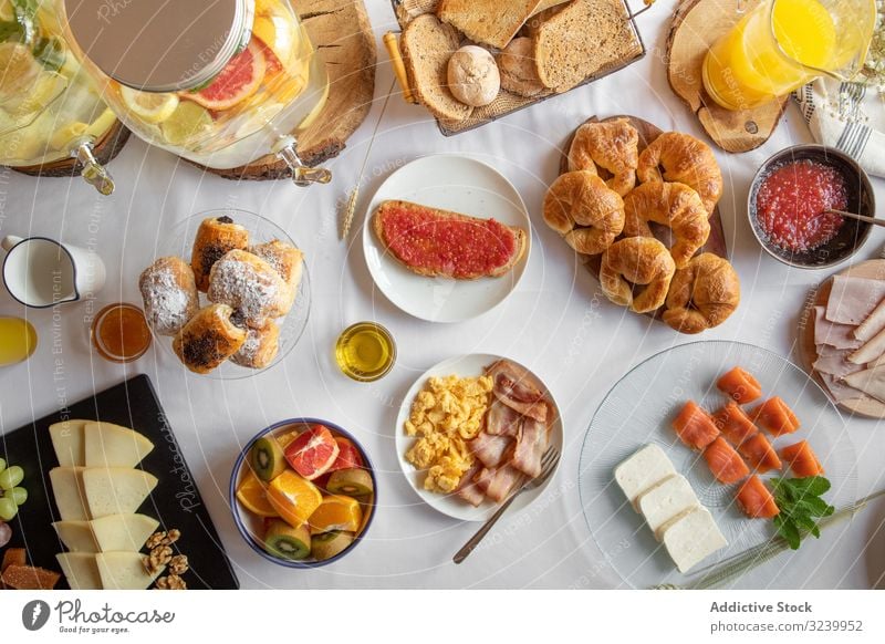 Assorted food table with baked products seafood fruit juices breakfast buffet assortment smorgasbord meal delicious choice healthy variety brunch cuisine