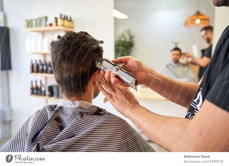 Man Getting His Hair Cut at a Barber Shop · Free Stock Photo