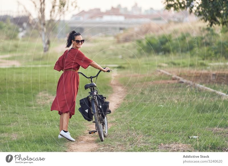 woman push bike