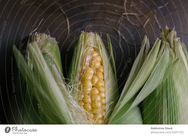 Phases of fresh corn peeling ripe phase concept table kitchen vegetable food growth agriculture nature snack season kernel seed plant healthy edible rustic