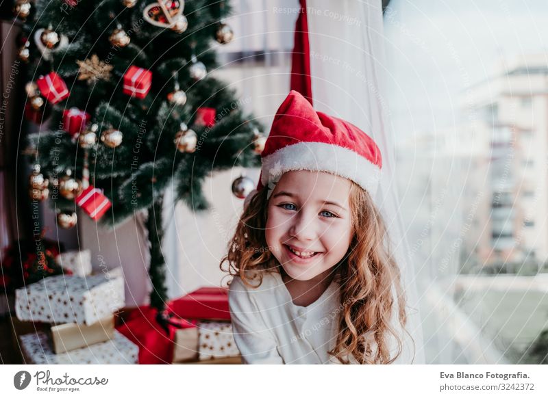 portrait of beautiful kid girl at home by the christmas tree Lifestyle Joy Beautiful Calm Winter House (Residential Structure) Feminine Toddler Girl Sister