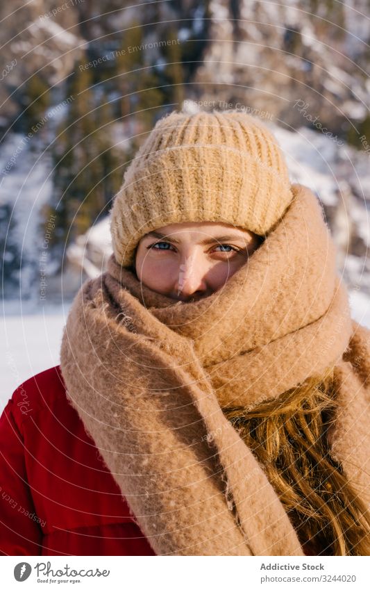 Frozen woman wrapped in scarf on winter day cold frozen siberia snowy mountain nature rock hill russia female environment wild adventure activity protection
