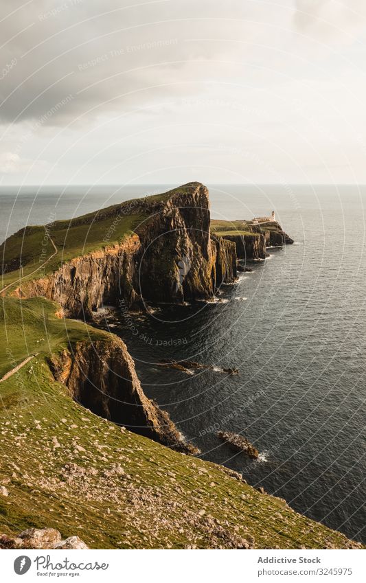 Rocky coast among tranquil ocean water in sunny day sea adventure height headland trip coastline cliff fresh freedom road solitude marine endless shore scotland