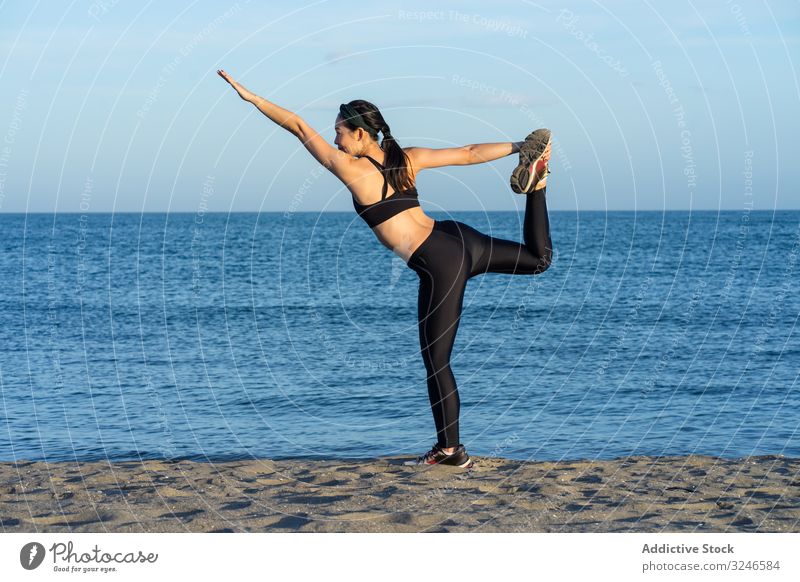 Content sportswoman in active wear doing yoga at seashore - a Royalty Free  Stock Photo from Photocase