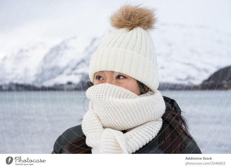 Joyful young woman in warm clothes cheerful winter joy norway kaldfjorden scarf beauty natural smile street charm appearance charismatic kind pleased happy cold