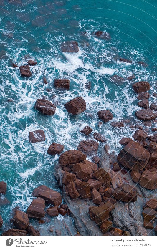 rocks on the blue sea in the coast in Bilbao Spain Rock Ocean Blue Waves Water Coast Exterior shot Vacation & Travel Destination Places Nature Landscape