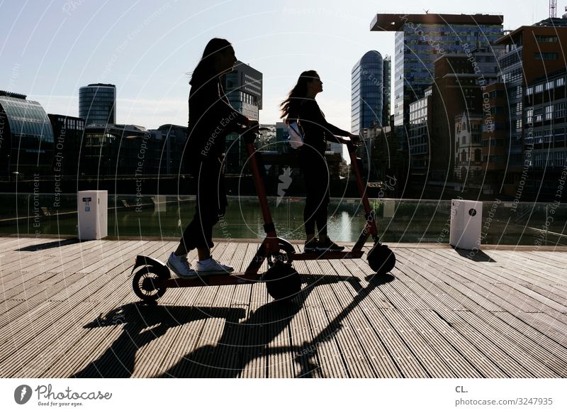 electric scooter Lifestyle Leisure and hobbies Human being Feminine Girl Young woman Youth (Young adults) Infancy 2 13 - 18 years Duesseldorf Town Places