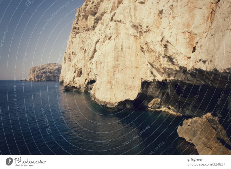 ravages of time Environment Nature Landscape Elements Earth Water Sky Cloudless sky Horizon Beautiful weather Rock Coast Ocean Large Blue Cave Concave Canyon