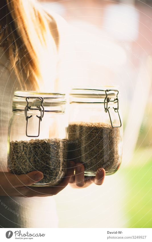 sustainable - woman with preserving jars as storage containers Sustainability sustainability Preserving jar To hold on grains do-it-yourself Healthy Eating