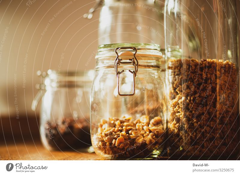 Preserving jars filled with food Sustainability sustainability preserving jars nuts Oat flakes Keep storage container Containers and vessels Colour photo Glass