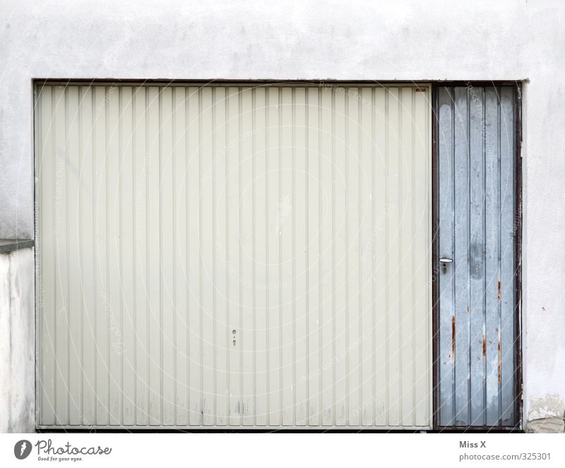garage Flat (apartment) Gloomy Gray White Garage Garage door Gate Closed Colour photo Subdued colour Exterior shot Deserted Copy Space top Copy Space middle