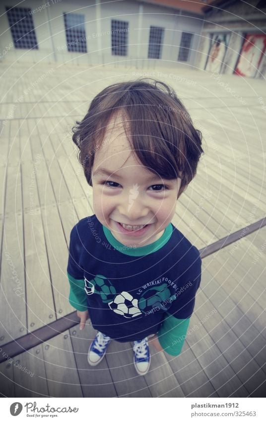 a big smile Human being Child Boy (child) Life Body Head Hair and hairstyles Face Eyes Nose Mouth Teeth Feet 1 3 - 8 years Infancy T-shirt Footwear Sneakers