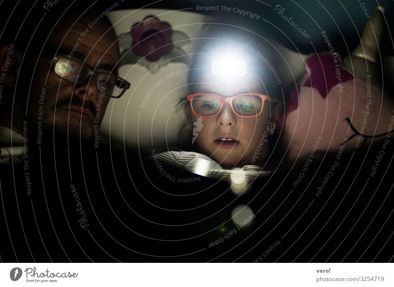 Headlamp, girl, reading Education Girl Father Adults 2 Human being Eyeglasses Moustache headlamp Discover Relaxation To enjoy Reading Illuminate Lie Looking