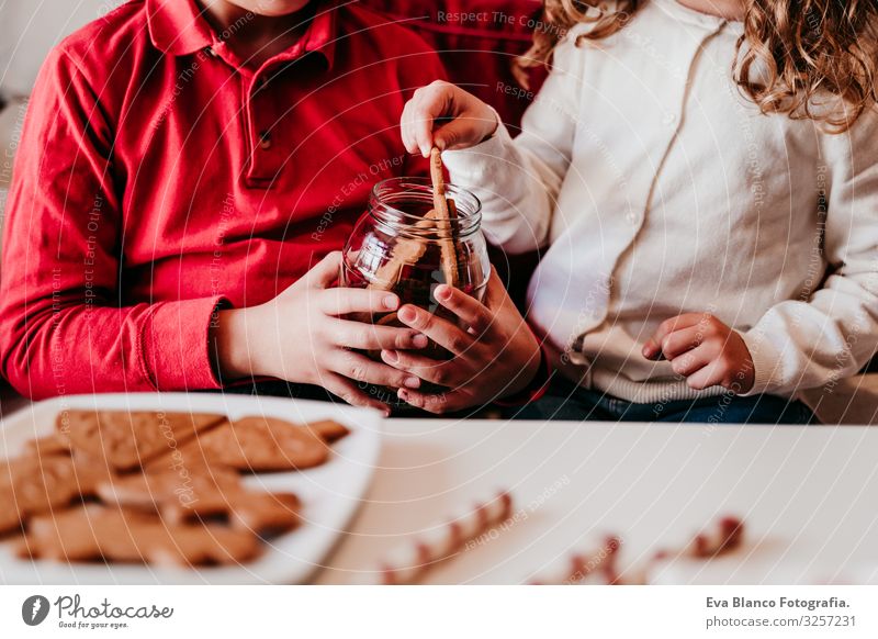 beautiful brother and sister at home having a delicious snack. Christmas concept Snack Cookie Candy Brother Sister siblings Christmas & Advent Home Blonde