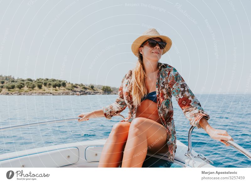 Young woman enjoying on the boat Lifestyle Joy Vacation & Travel Tourism Adventure Freedom Cruise Summer Summer vacation Ocean Human being Feminine