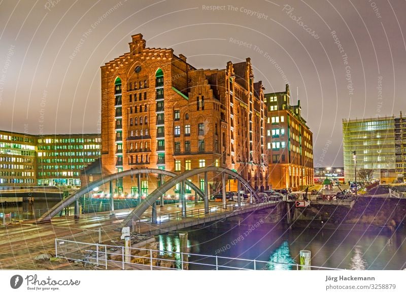 Speicherstadt at night in Hamburg Beautiful Office Landscape Sky Town Bridge Building Architecture Old Historic Blue Advertising Canal brick clinker Elbe