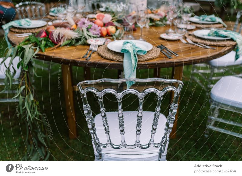 Wedding table decoration in rustic style placed outdoors wedding setting celebration arrangement banquet wooden event party marriage ceremony love dinner