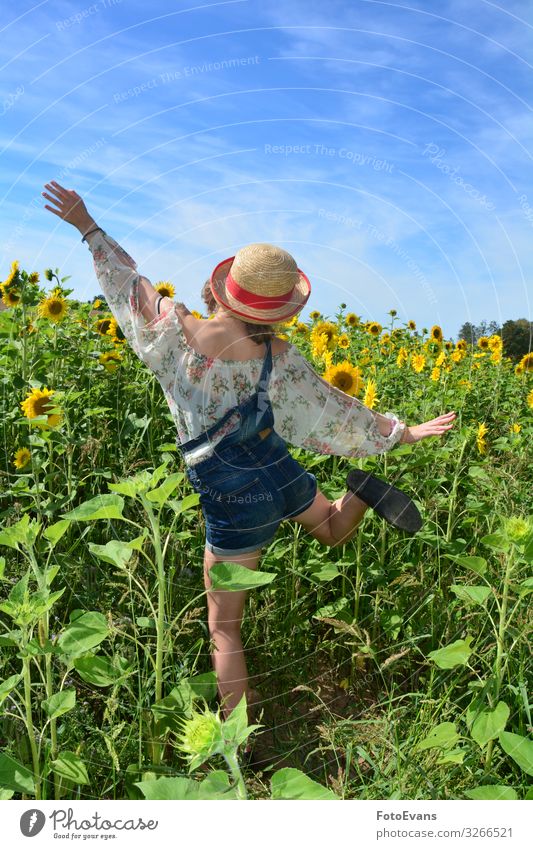 Girl from behind, jumping up and down in a field of sunflowers Joy Happy Athletic Trip Summer Human being Feminine Young woman Youth (Young adults) 1