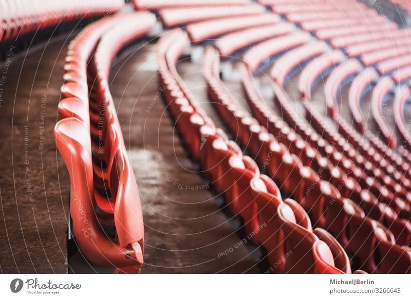 Empty red seats in unrecognizable sports stadium empty modern architecture free neutral anonymous many large audience geisterspiel fussball football soccer