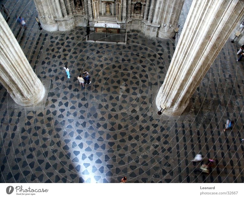in the cathedral Building Gothic period Human being Light Mosaic Floor covering Fence Religion and faith Spain House of worship Cathedral Perspective Column