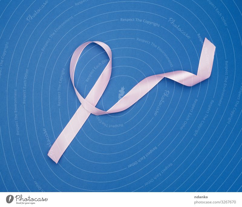 blue silk thin ribbon twisted on a pink background - a Royalty Free Stock  Photo from Photocase