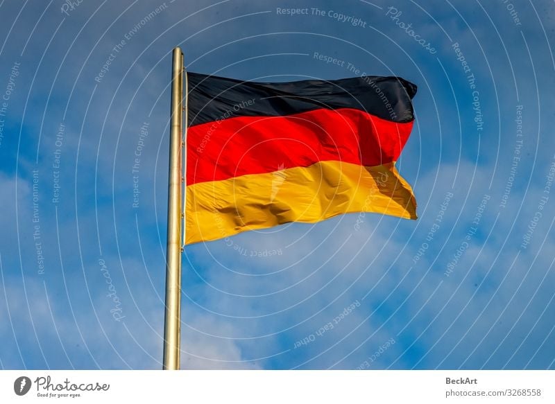 Germany flag black red gold blowing on the flagpole - a Royalty Free Stock  Photo from Photocase