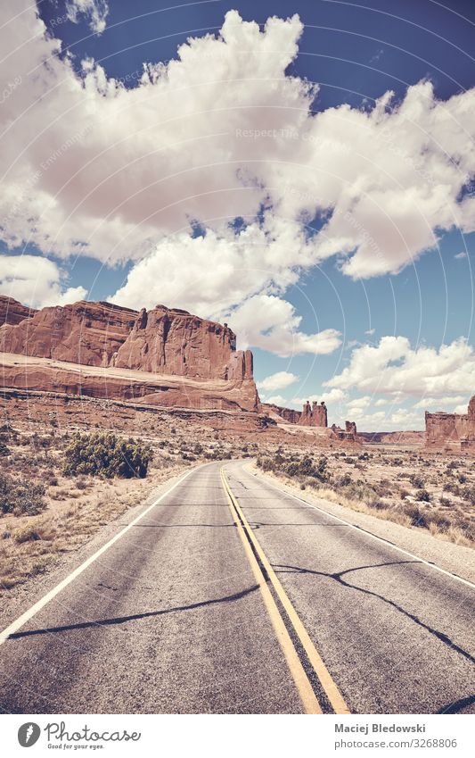 Scenic road in Arches National Park, USA. Vacation & Travel Tourism Trip Adventure Freedom Nature Landscape Sky Rock Canyon Street Highway Retro Utah America