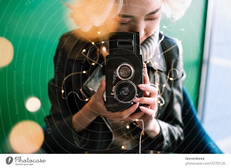 Female Holding Vintage Film Camera With Fairy Lights And Bokeh A Royalty Free Stock Photo From Photocase