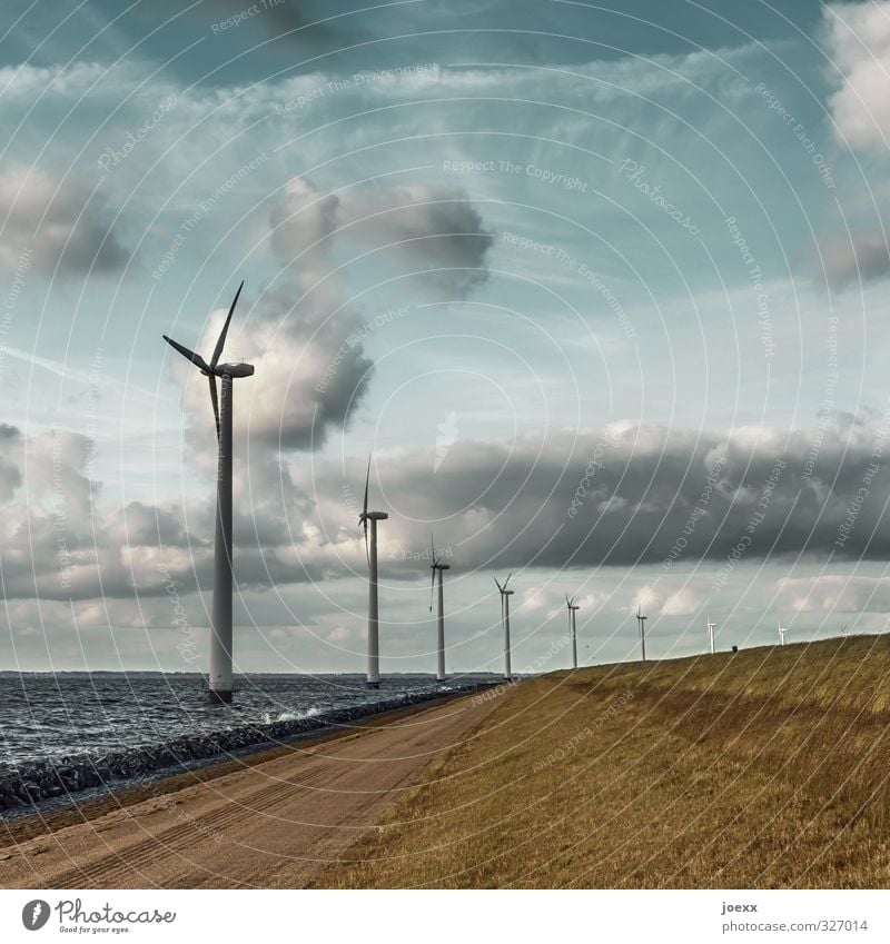 wind machines Renewable energy Wind energy plant Environment Landscape Air Water Sky Clouds Horizon Beautiful weather Meadow Hill Waves Coast Blue Brown Gray
