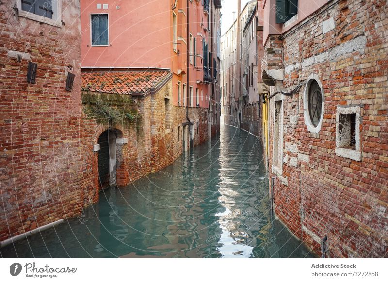Waterway and ancient buildings at city street water canal old architecture brick historical colorful landmark travel view town empty tourism famous venice italy