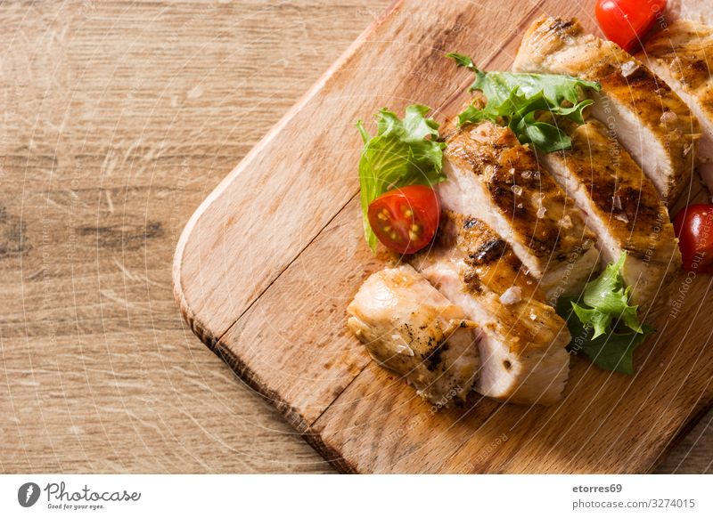 Grilled chicken breast with vegetables on wooden table Food Healthy Eating Food photograph Chicken Meat Meal Dinner Plate Salad Frying BBQ Roasted fish Tomato
