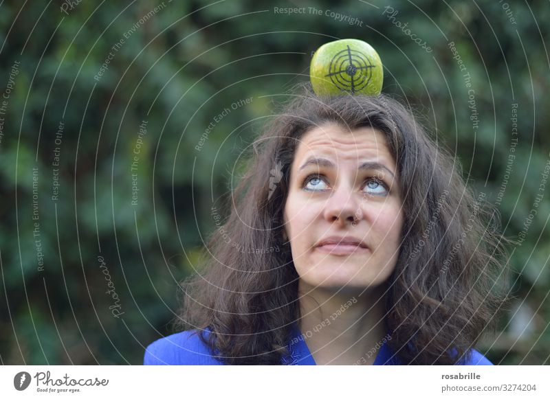 lost | if he does not hit - woman with apple on her head on which a target is drawn, looks very sceptical apples Woman Adults Head 30 - 45 years brunette Arrow
