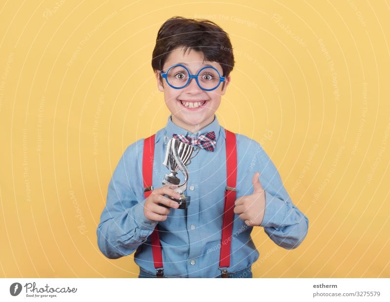 Happy boy with winning cup Playing Chess Feasts & Celebrations Award ceremony Success Science & Research Child School Schoolchild Human being Masculine Infancy