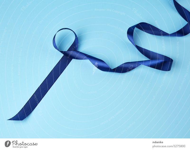 blue silk thin ribbon twisted on a pink background - a Royalty Free Stock  Photo from Photocase