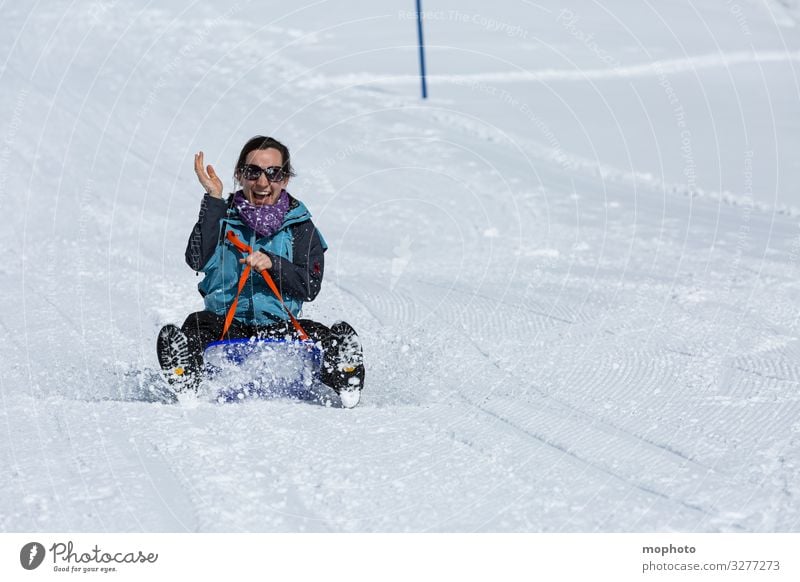 Young woman sledging Trip Driving holidays Joy Happiness luck fortunate jeizinen chill Leukerbad Sledge Sledding Skid Sleigh Snow Switzerland ski slope Ski run