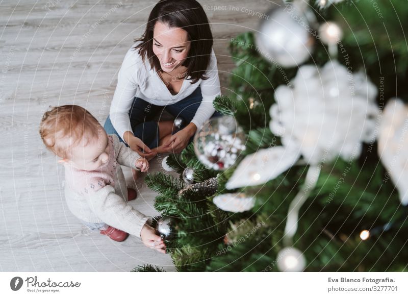 happy mother and baby girl decorating the Christmas tree Mother motherhood Happy Cute Baby Girl one year Christmas & Advent Tree Joy Family & Relations Love