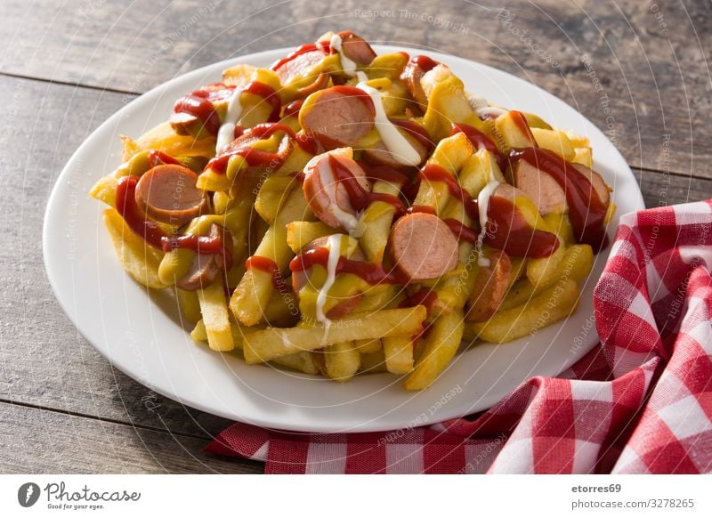 Typical Latin America Salchipapa. Sausages with fries, ketchup Black Dinner Fast food Fat Food Food photograph French fries Fries Ketchup Lunch mayo Mix Mustard