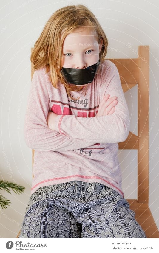 Finally calm: girl sits on a chair with her mouth taped shut Flat (apartment) Chair Girl Infancy 1 Human being 3 - 8 years Child Blonde Sit Argument Aggression