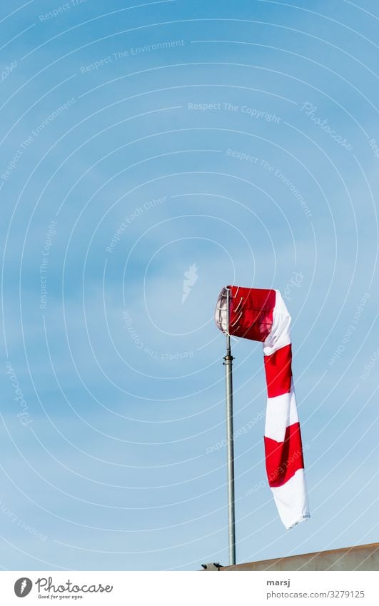 Flaccid windsock in front of a blue sky Windsock Sky Shallow depth of field Contrast Light Day Neutral Background Isolated Image Copy Space top Deserted