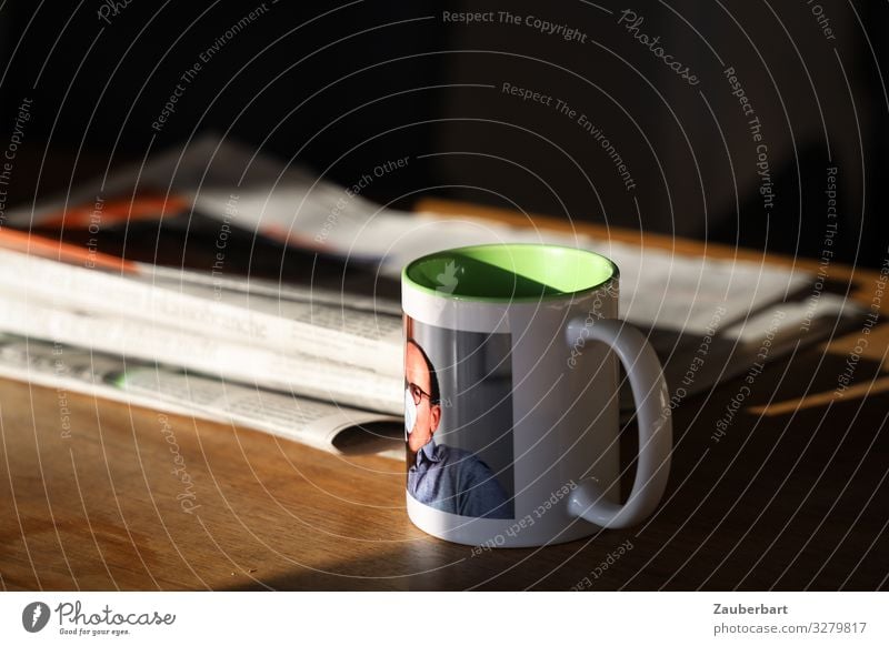 Selfie-cup Drinking Hot drink Coffee Cup Mug Living or residing Table Man Adults 1 Human being 45 - 60 years Newspaper Magazine Reading Warmth Serene Interest