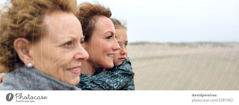 Three generations female looking at sea on the beach Lifestyle Joy Beautiful Beach Ocean Child Internet Human being Woman Adults Mother Grandmother